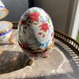 Porcelain egg on foot