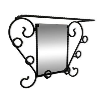 Wall-mounted coat rack with its mirror.