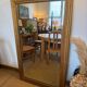 Grand miroir ancien en bois patiné doré