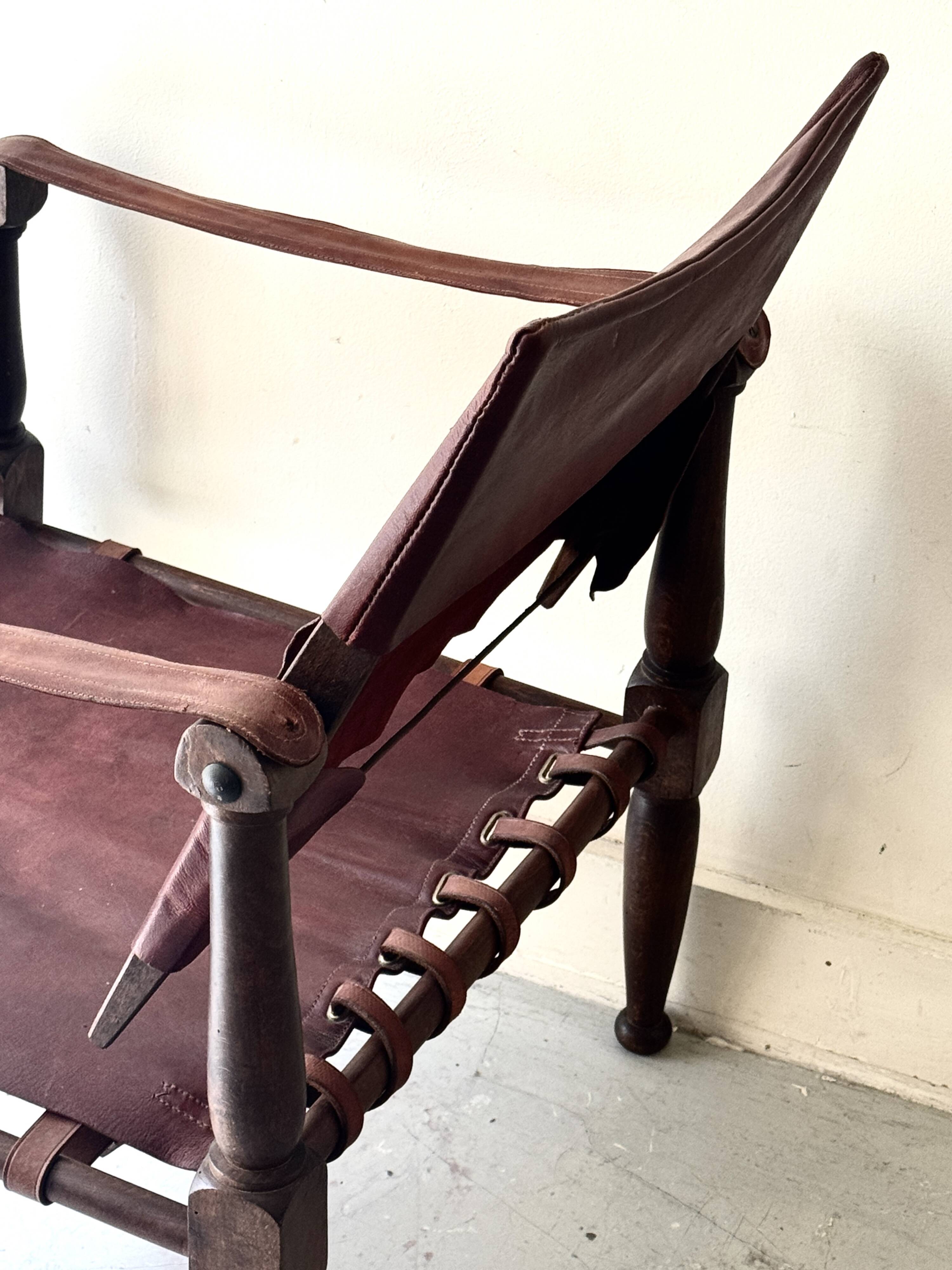 Scandinavian safari armchair in wood & burgundy leather upholstery 20th century
