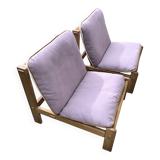 Pair of solid wood and leather lounge chairs, European work, circa 1970.