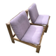 Pair of long armchairs in solid wood and leather, European work, circa 1970.