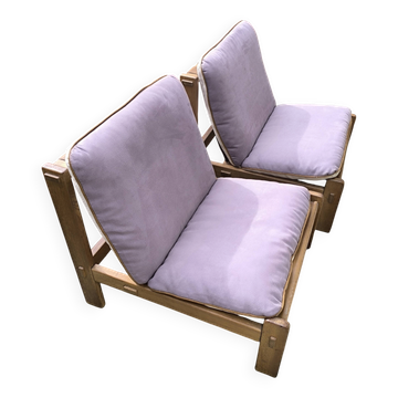 Pair of long armchairs in solid wood and leather, European work, circa 1970.