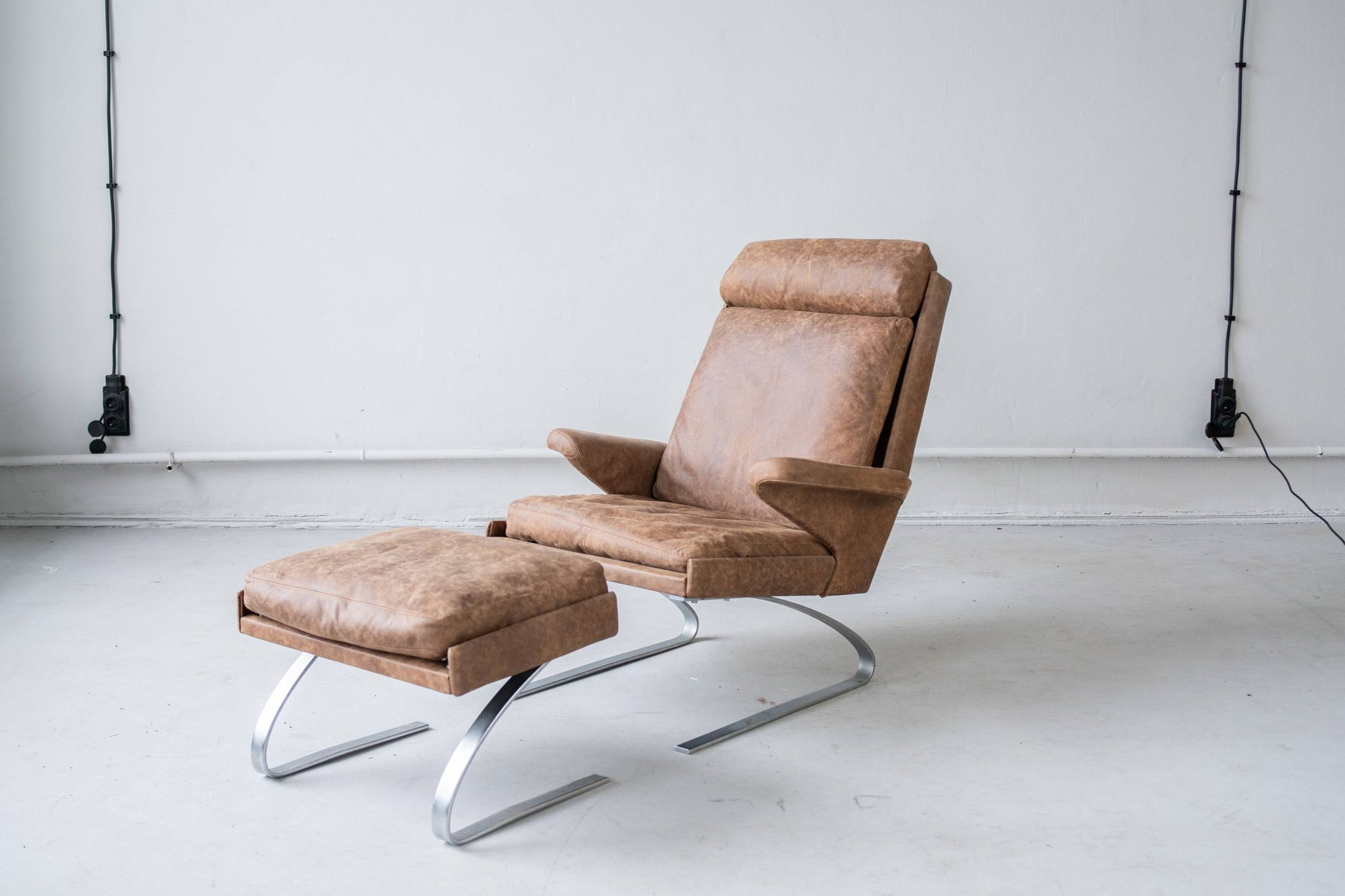 Vintage swing armchair and stool in leather by reinhold adolf for cor, 1970s, set of 2