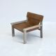 Stylish vintage armchair with saddle leather seat
