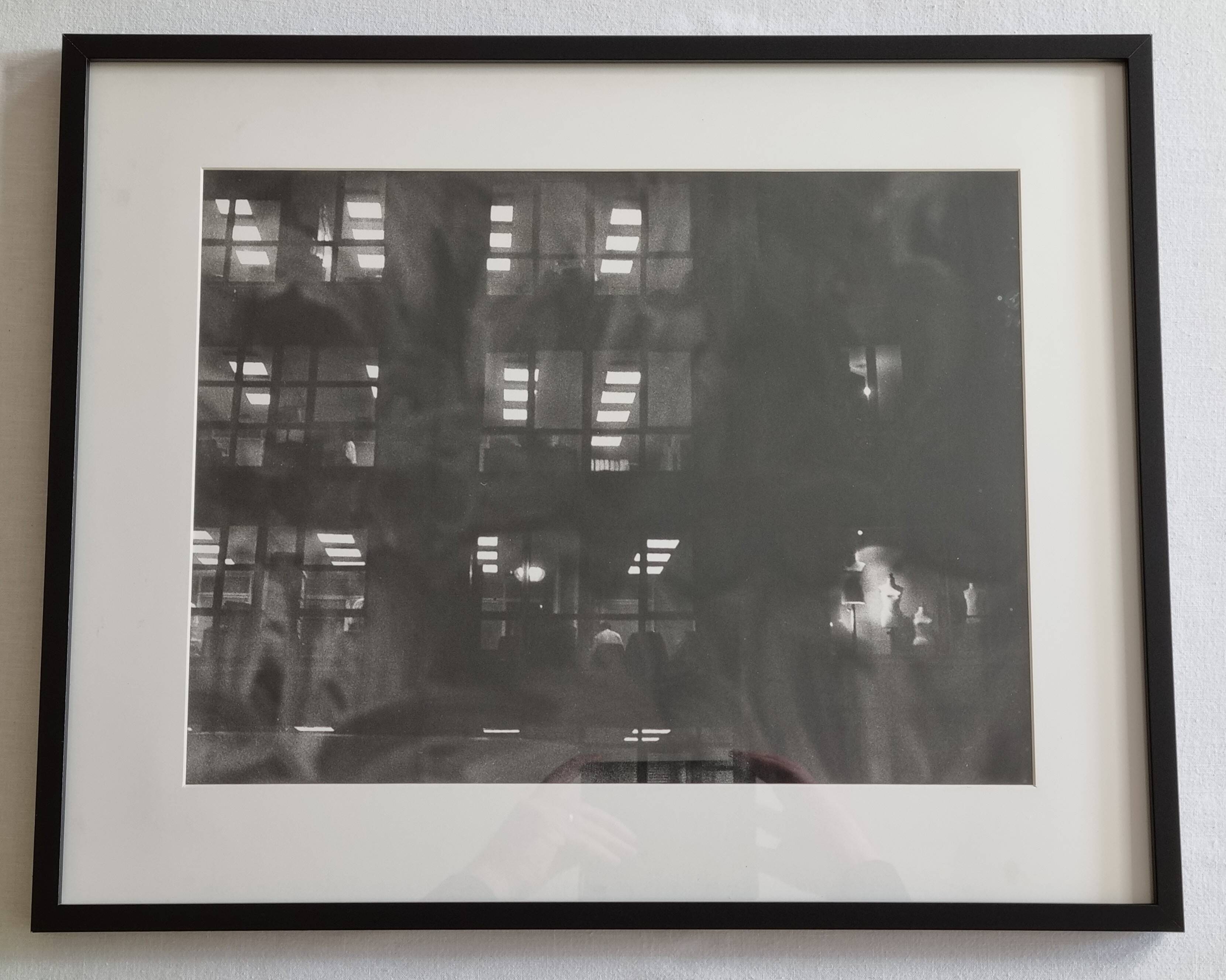 Framed black and white photograph of an urban scene by Rosine Nucimovici, 52x42 cm.