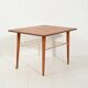 Table basse scandinave en teck avec étagère en laiton