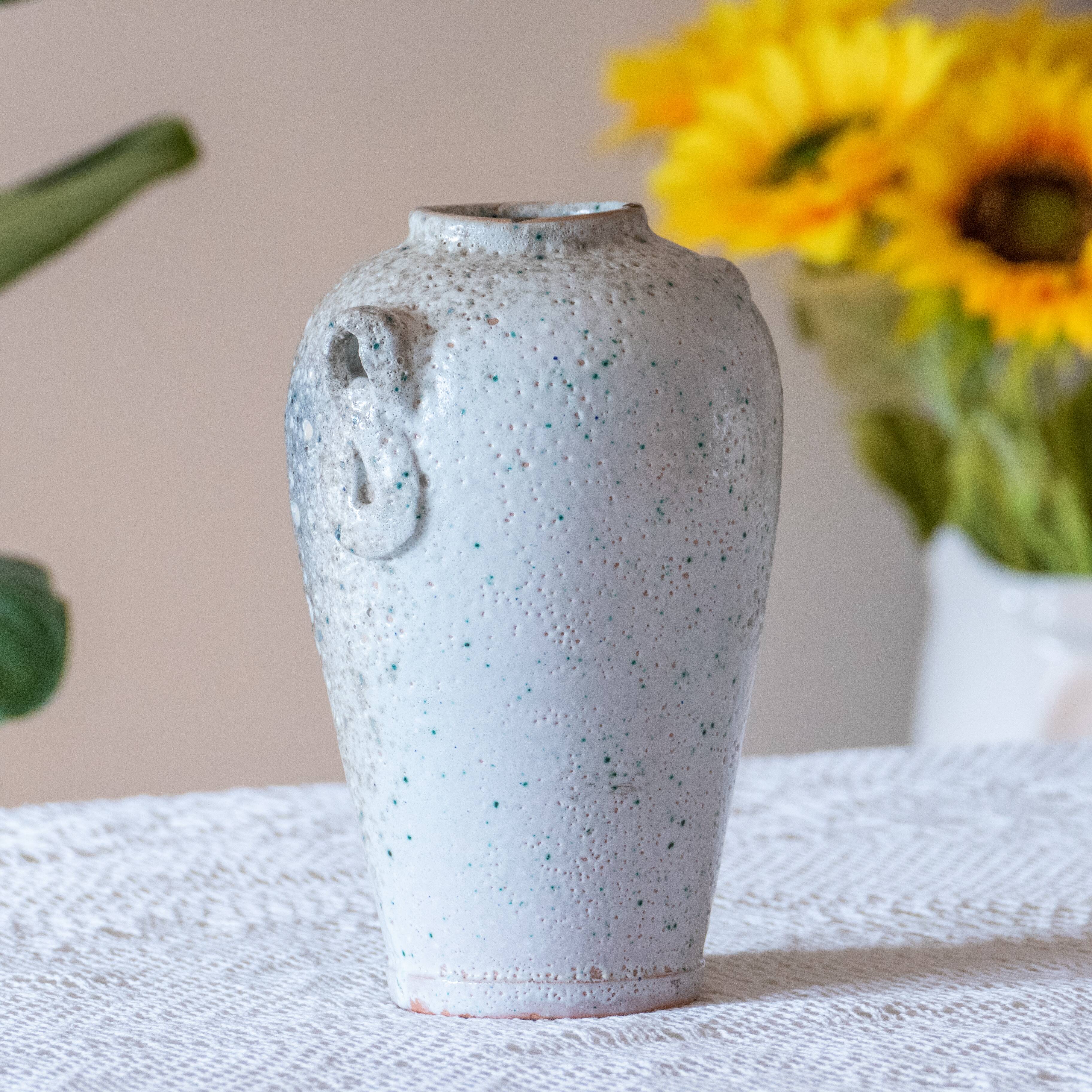 Old foam-glazed terracotta vase