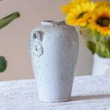 Old foam-glazed terracotta vase