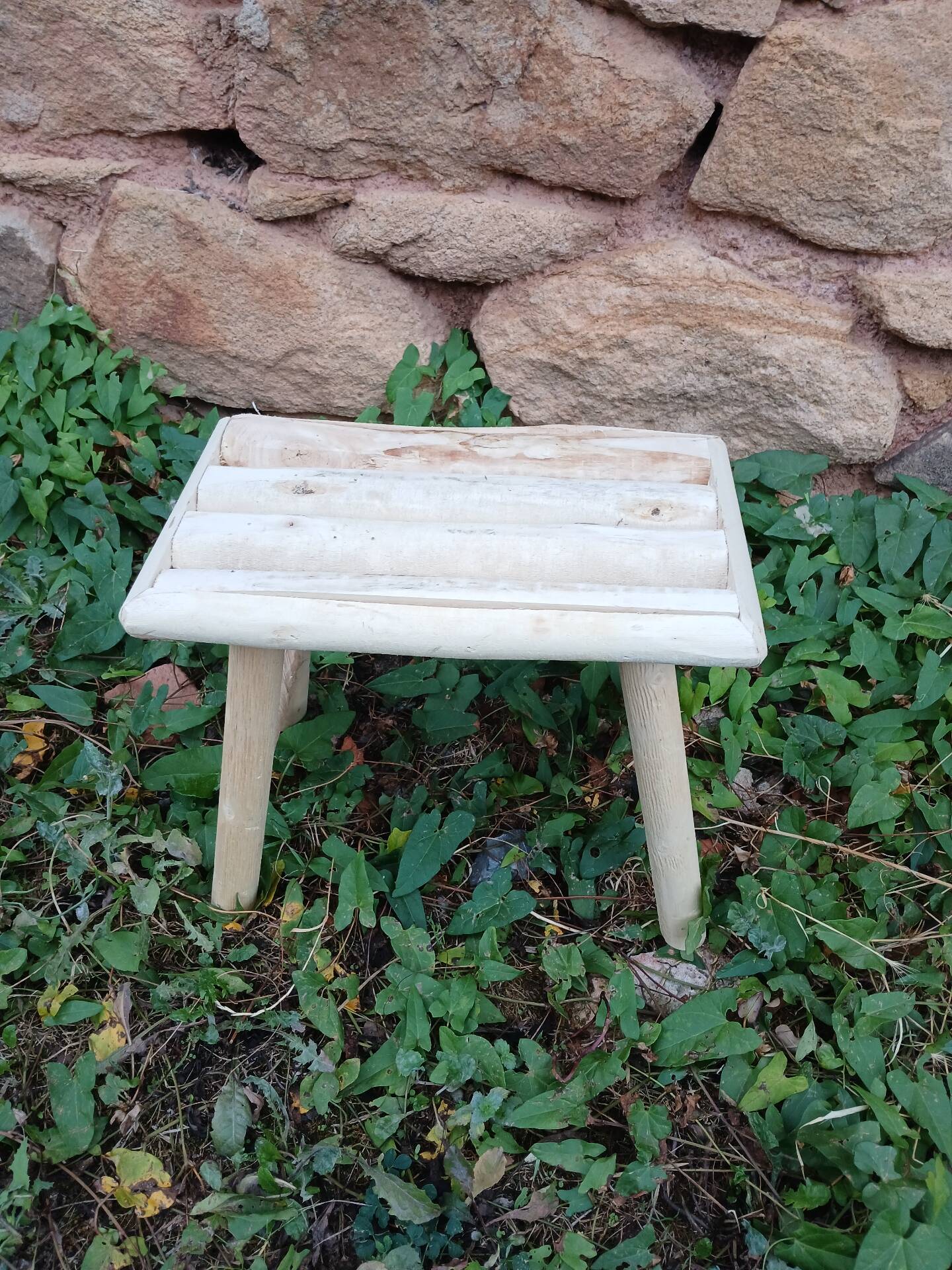 Small stool in raw wood