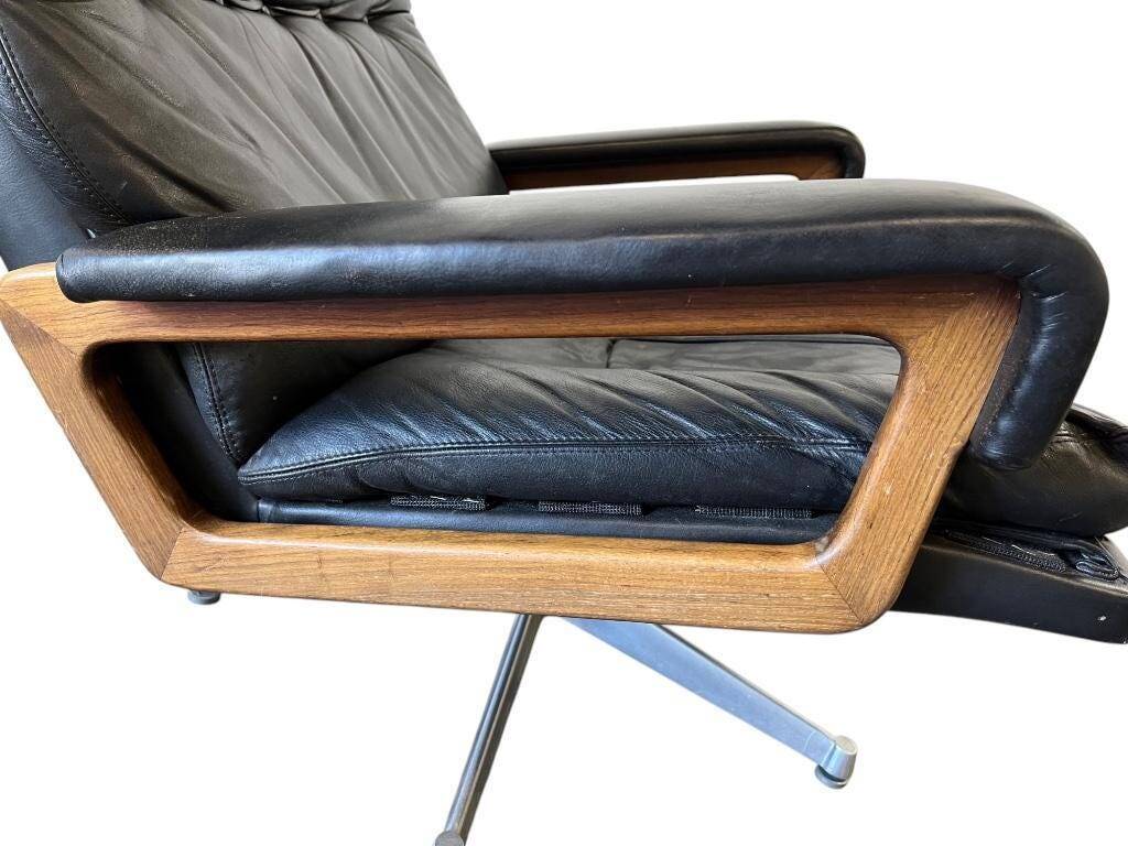 Vintage black leather armchair / Andre Vandenbeuck single seater armchair