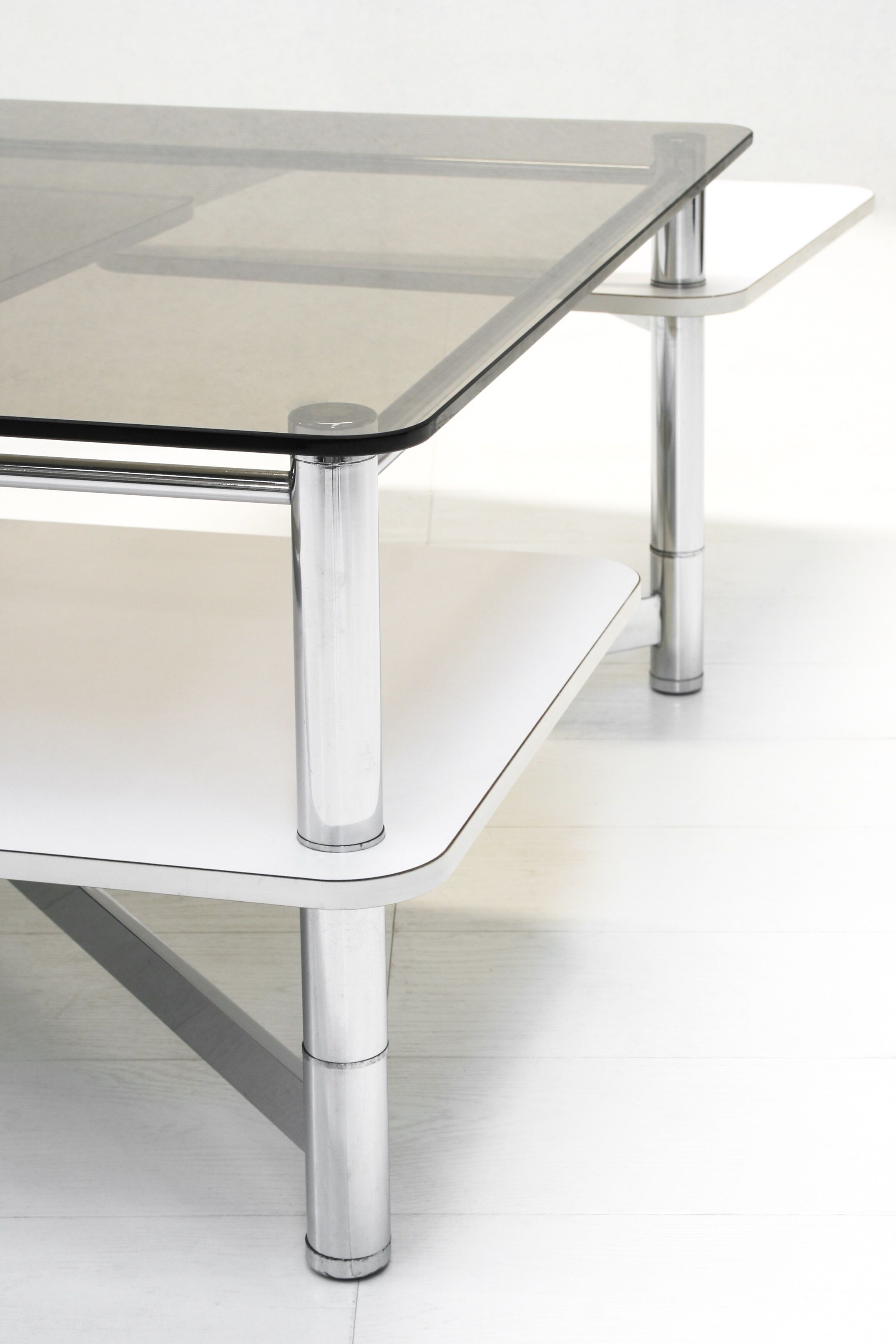 Vintage 1970s smoked glass swivel platform coffee table