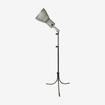 Industrial lamp on wrought iron tripod feet