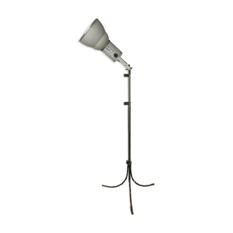 Industrial lamp on wrought iron tripod feet