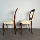 Pair of Victorian English chairs known as balloon chairs in solid mahogany.