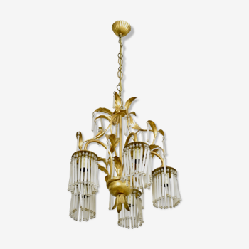 Golden metal chandelier in crystal pendants