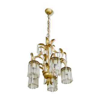 Golden metal chandelier in crystal pendants