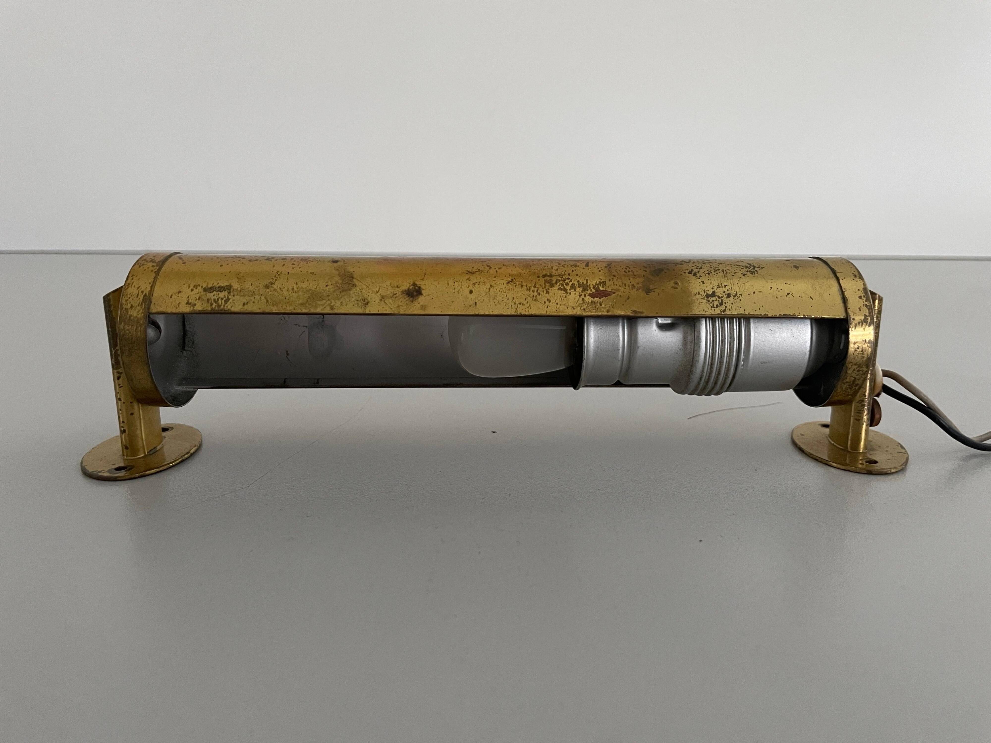 Small simple cylindrical brass wall light from the mid-century, 1950s, Germany.