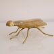 Empty vintage pocket in the shape of a brass insect