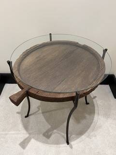 decorative wrought iron round table, glass and wood top.
