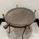 decorative wrought iron round table, glass and wood top.