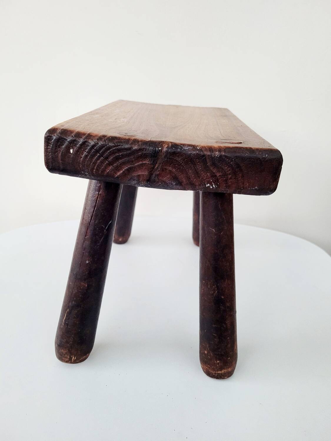 Old small solid wood milking stool