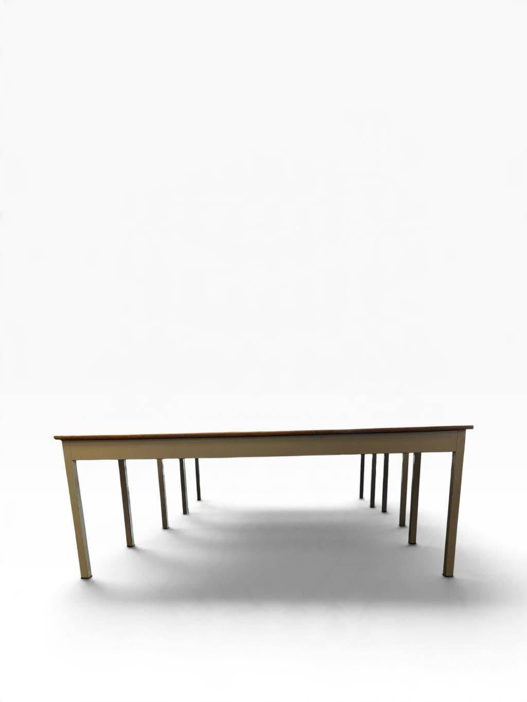 Vintage industrial table with a Formica top and wooden accents.
