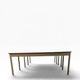 Vintage industrial table with a Formica top and wooden accents.