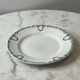 Set of 2 Saint Amand plates with laurel crown decoration.