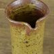 Sandstone pitcher signed "Guy Baudat"
