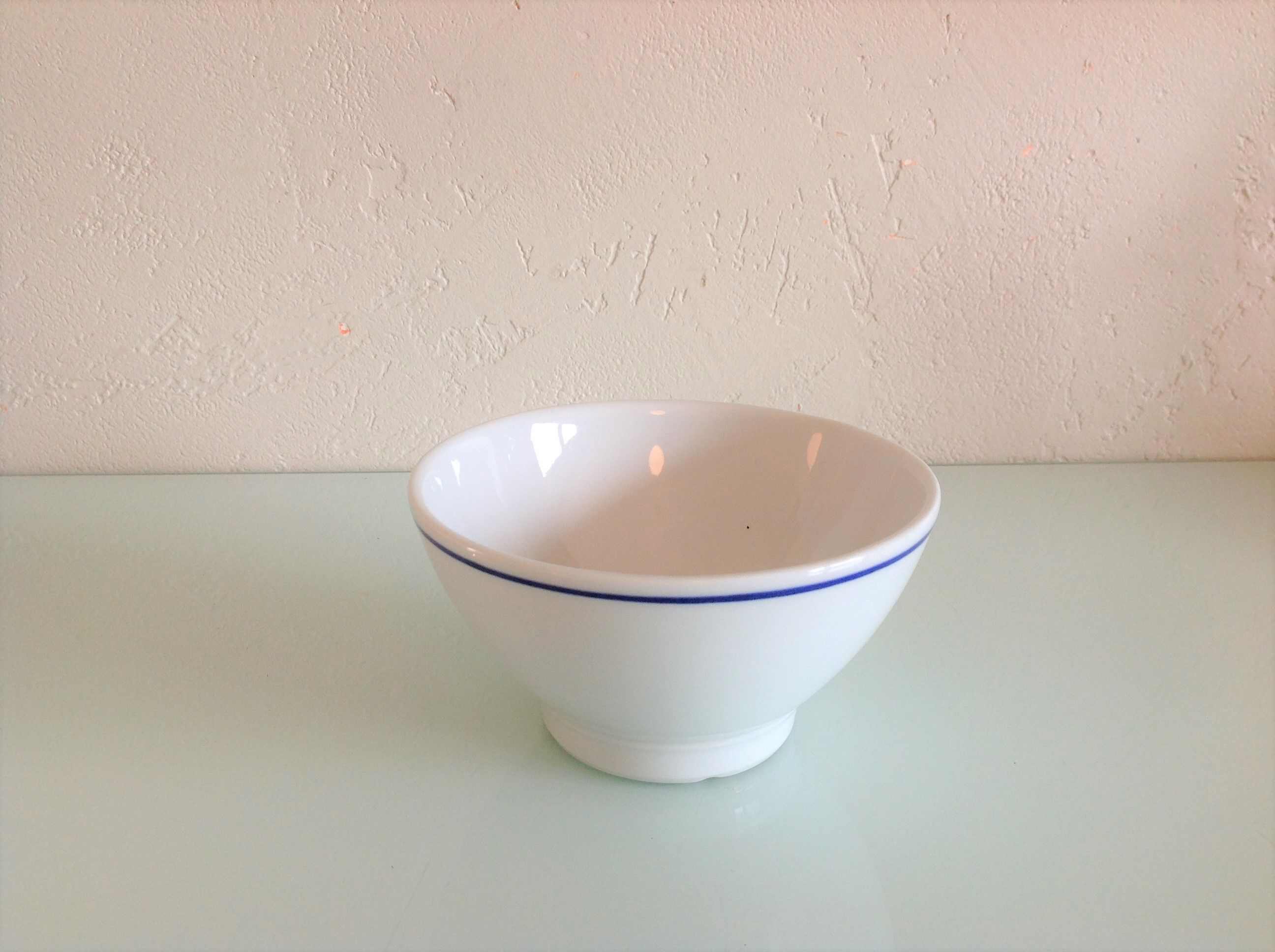 White bowl with blue border of the faienceries of Sarreguemines