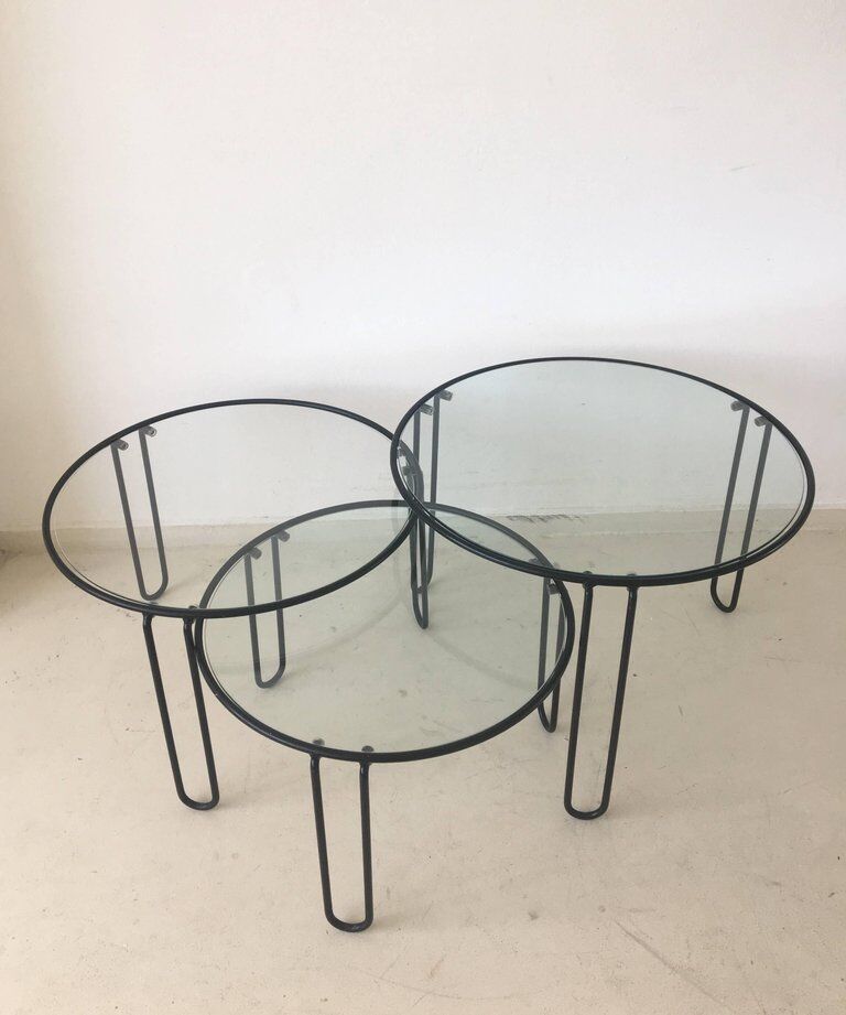Set of three coffee tables black glass in the middle of the century with legs and metal hairpin