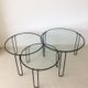 Set of three coffee tables black glass in the middle of the century with legs and metal hairpin
