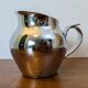 Antique stainless steel milk jug by Remy Letang