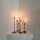 Gunnar Ander, four candlesticks, brass and glass, Ystad Metall, Swedish modern.