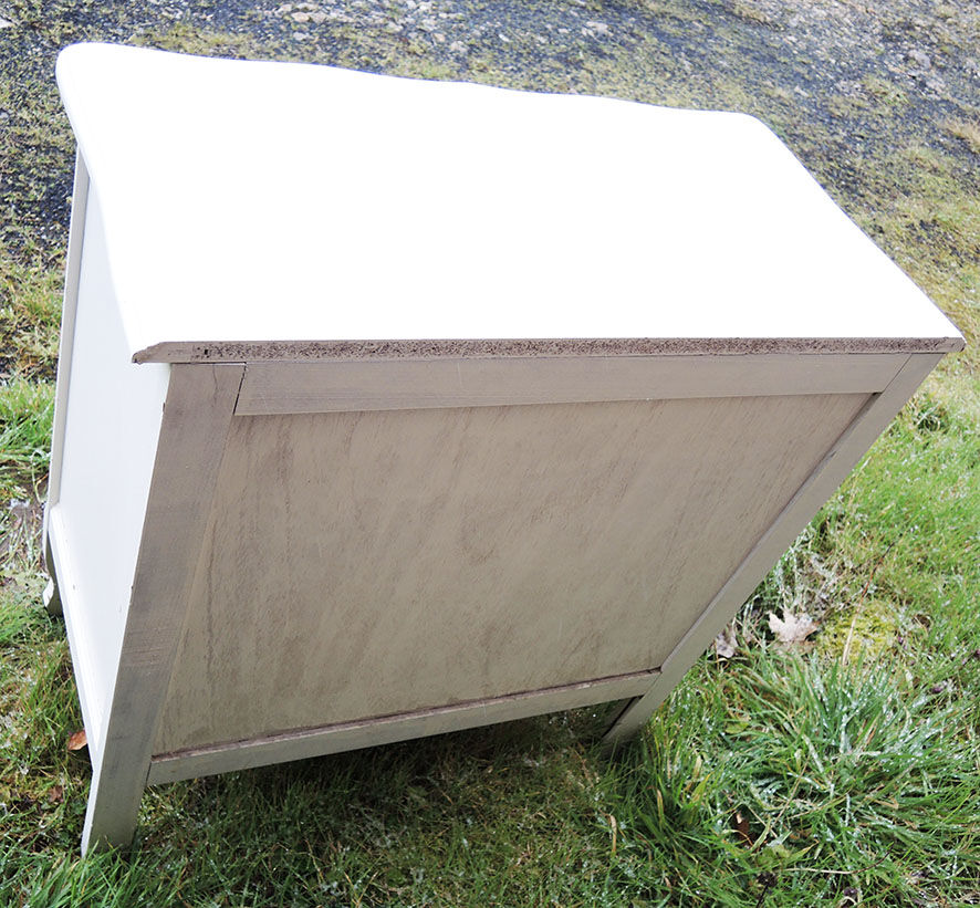 Old chest of drawers in white wood