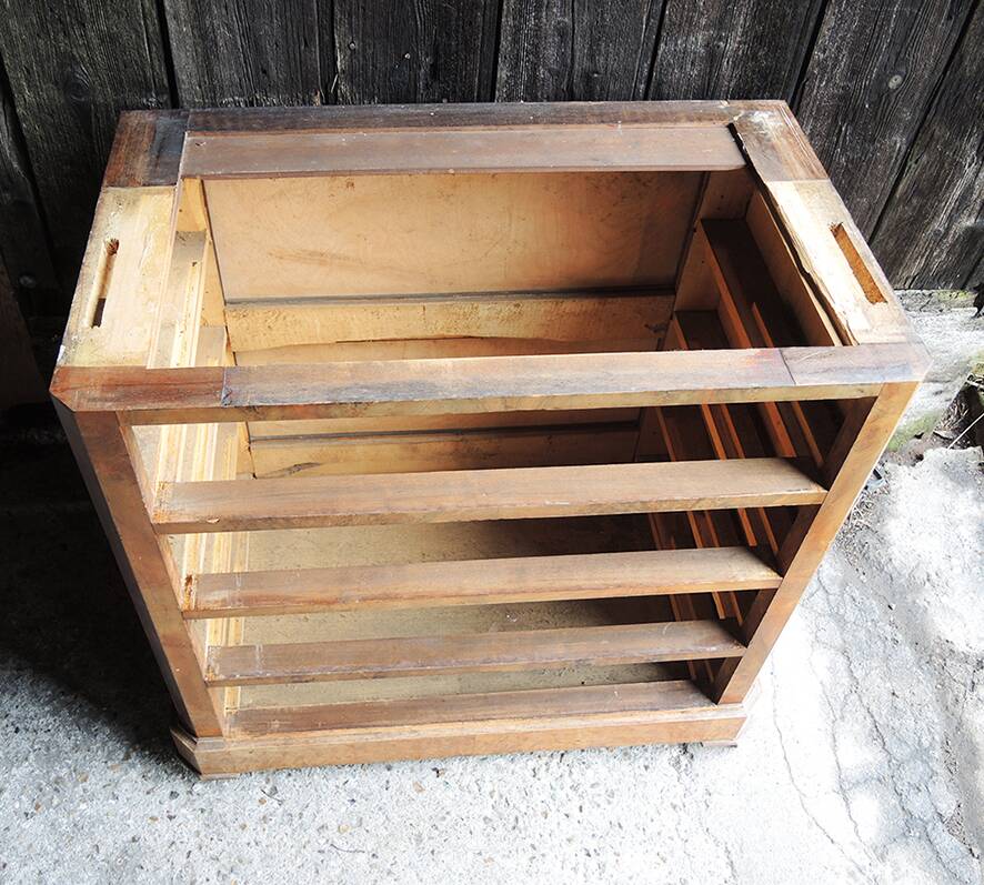 Old wooden chest of drawers with 4 drawers on wheels