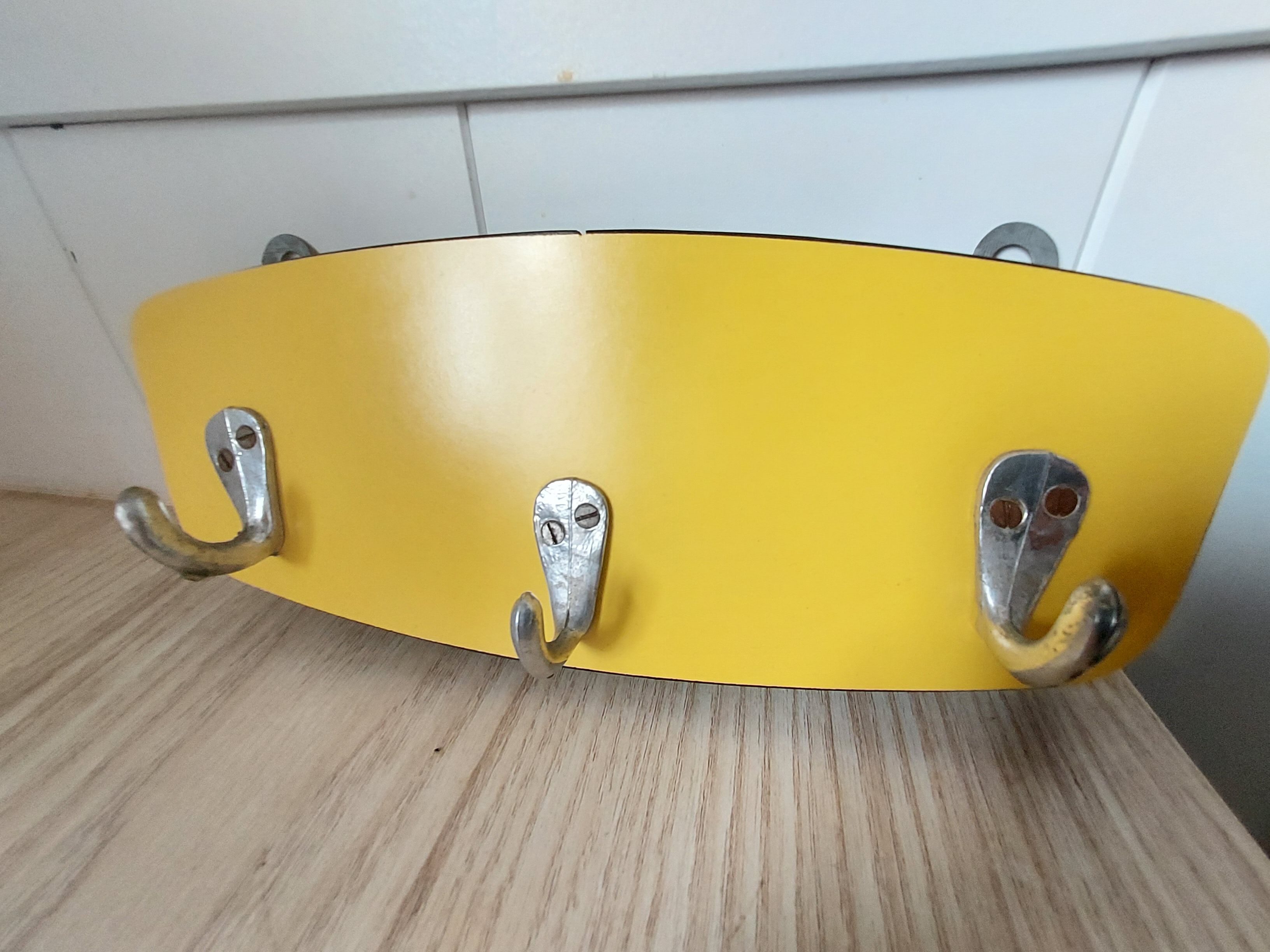 Yellow formica tea towel holder