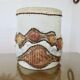 Ceramic lamp with double lighting and openwork design.
