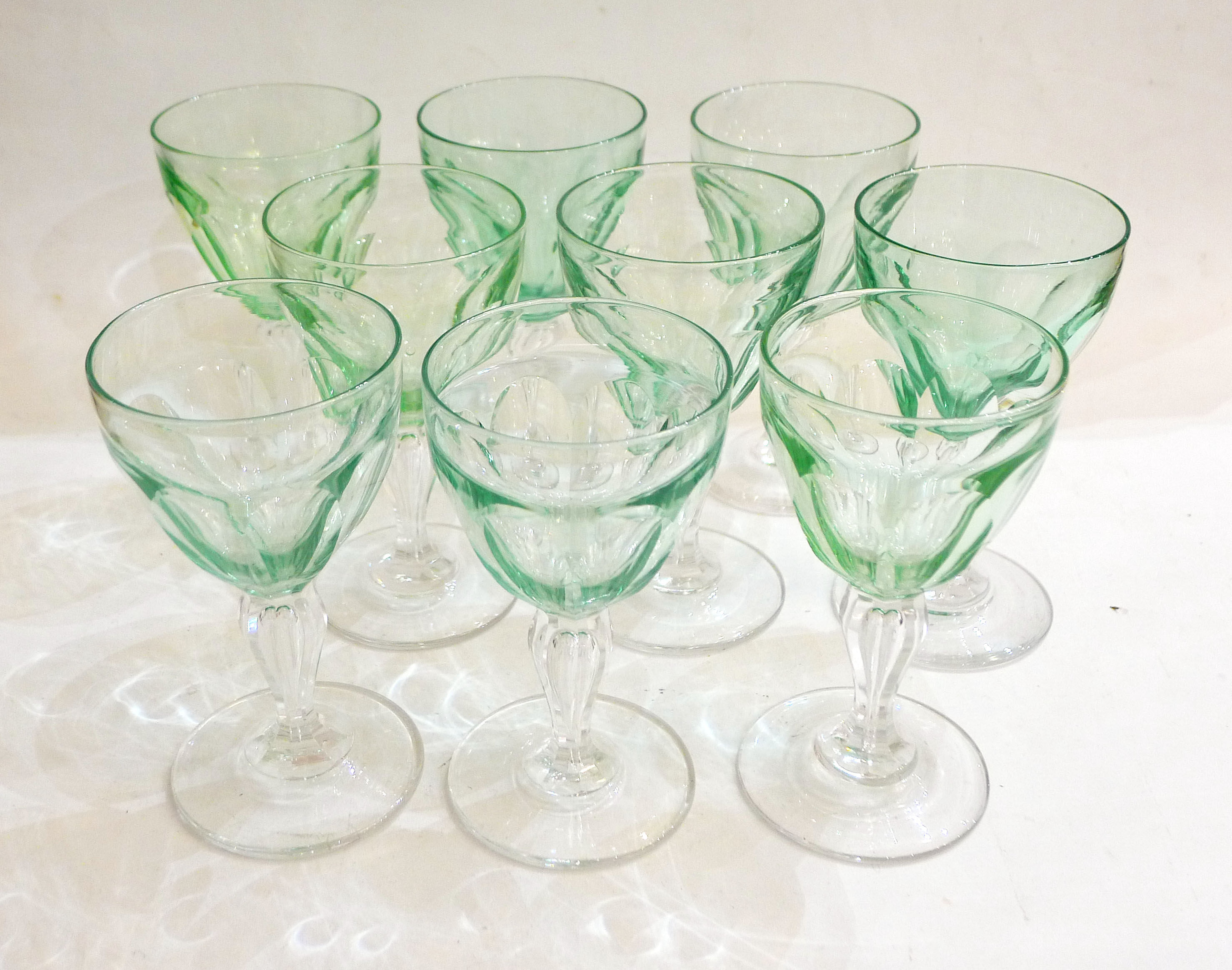 Set of nine glasses on foot in cut glass