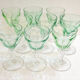 Set of nine glasses on foot in cut glass