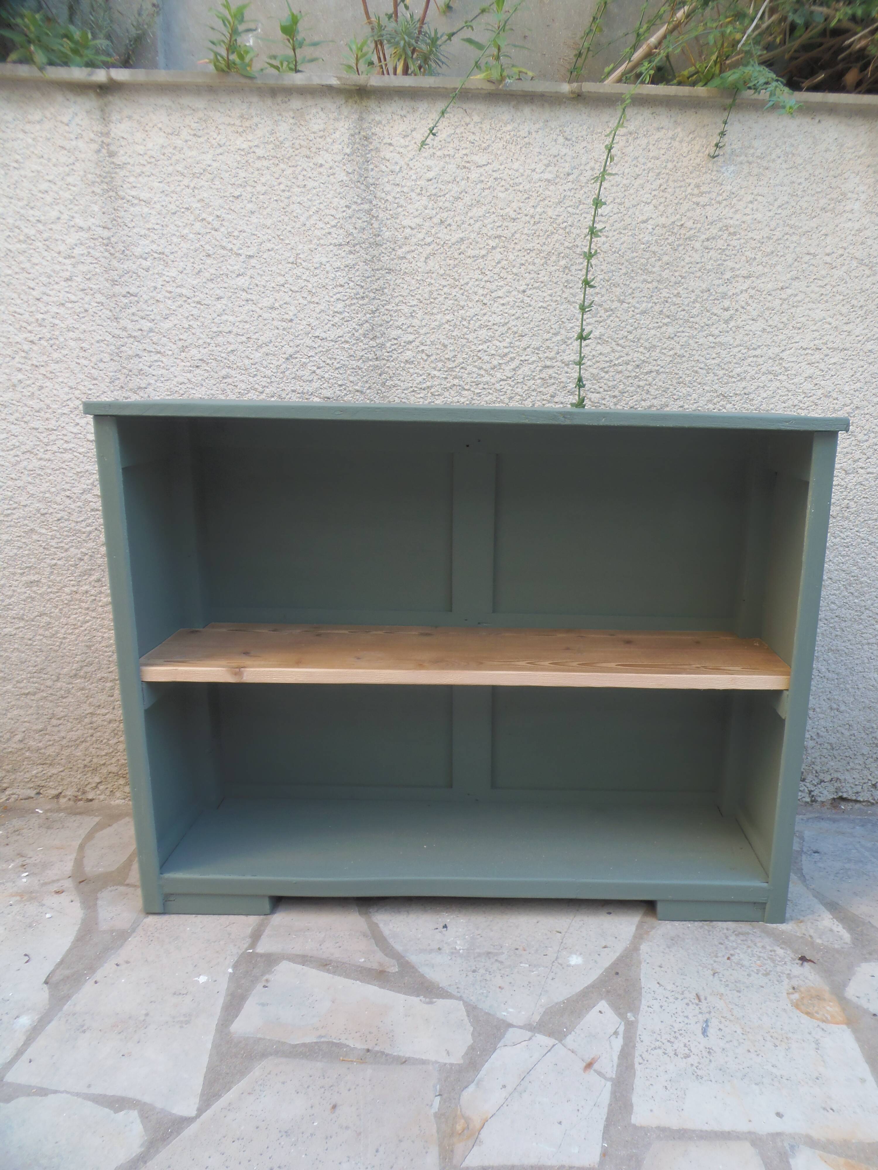 Vintage workshop furniture transformed into a re-enchanted bookshelf in smoky green.