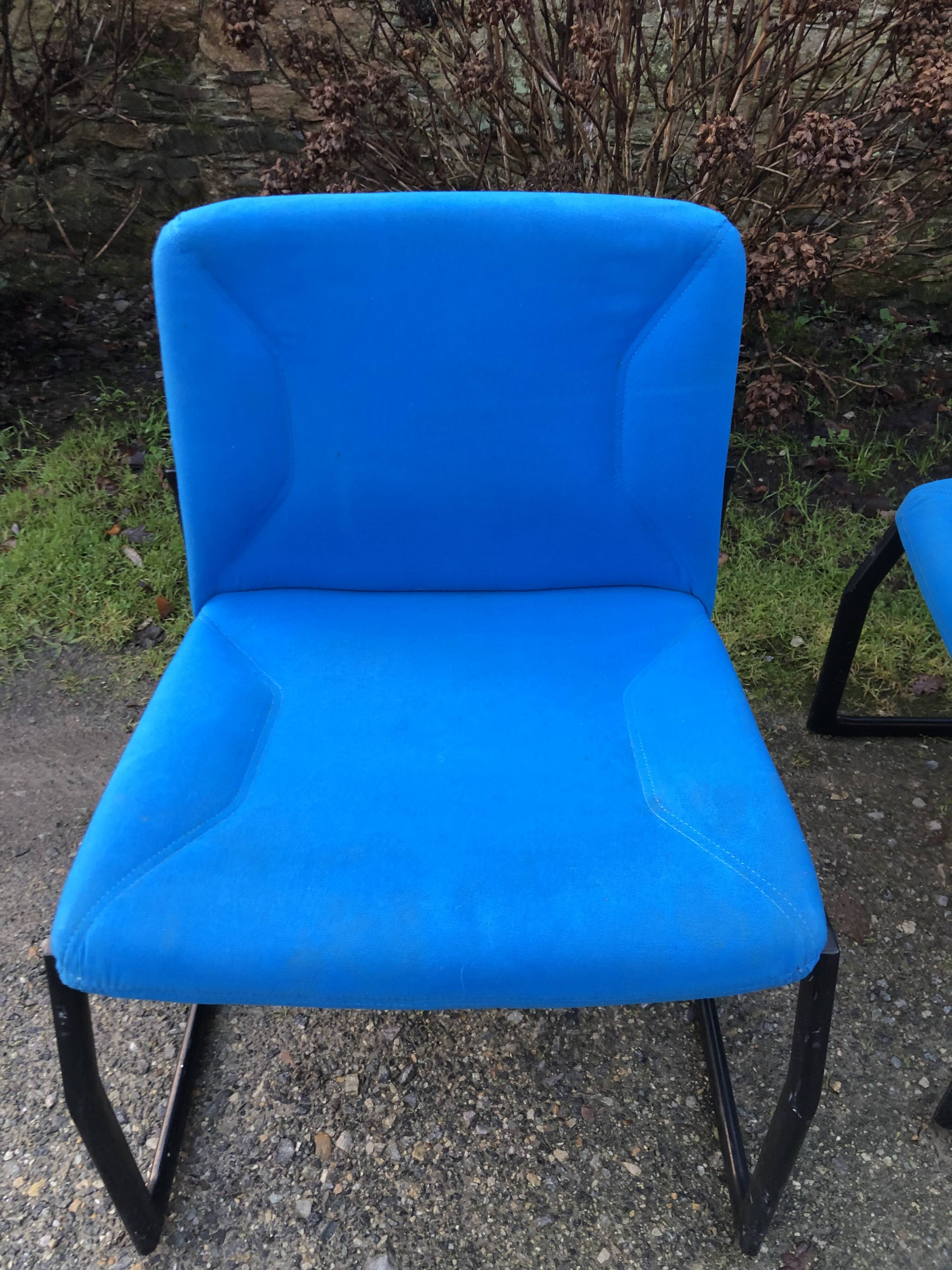 Electric blue fabric designer armchairs with black lacquered metal legs from the 80s.