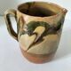 Glazed earthenware jug