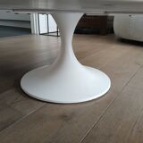 Round marble coffee table with tulip base.