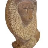 Sculpture of a lion in stone by Islay Grimes.