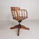 Oak office chair with a spring system and height adjustable, 1930s.