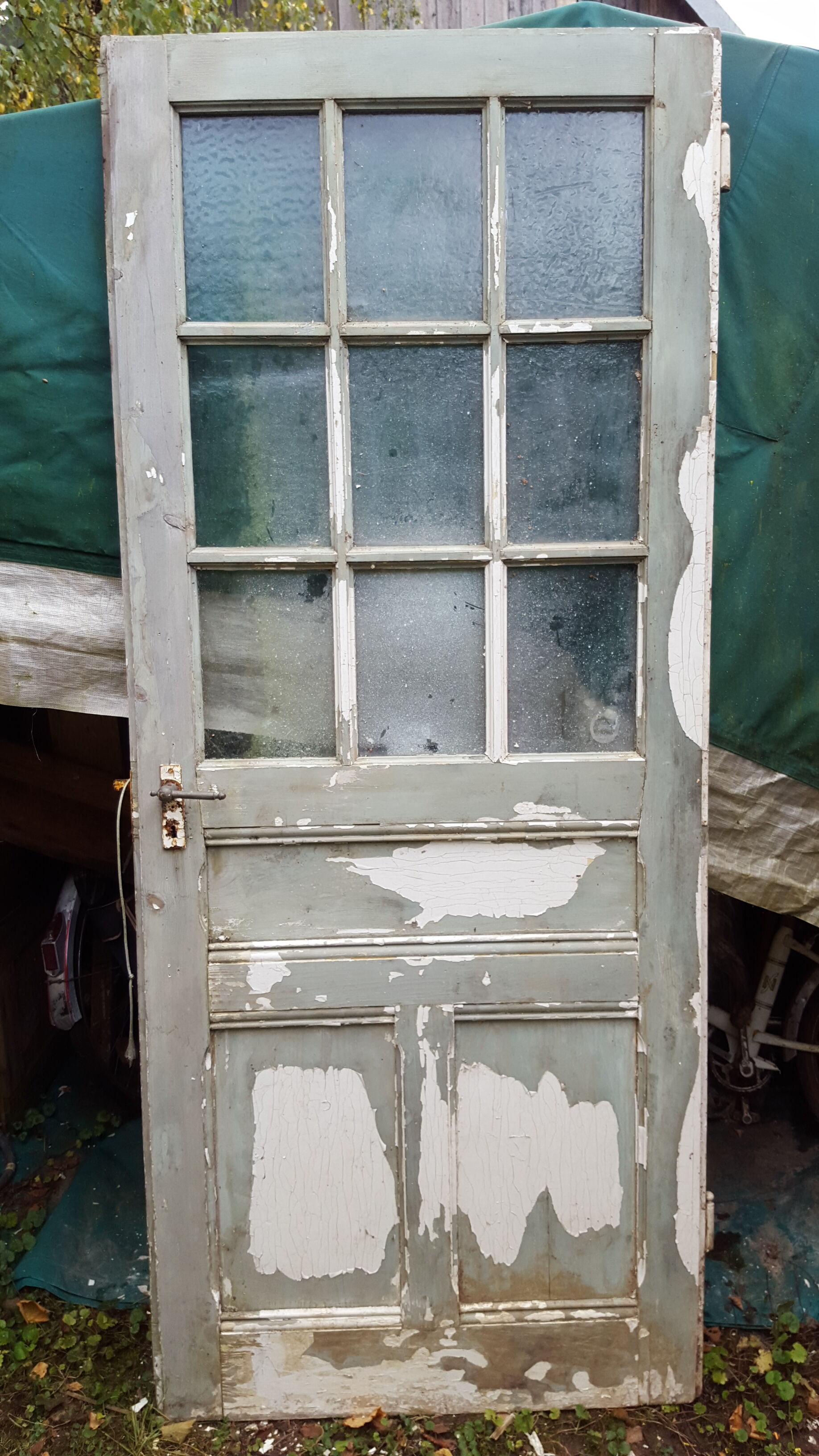 Old glass door beautiful patina. Height: 207.5 cm