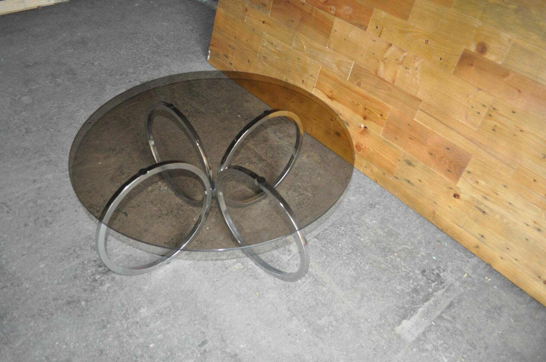 Vintage tubular coffee table in chrome with a transparent glass top, Mid-Century style 1960s.