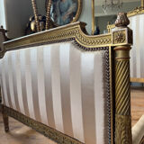 Pair of late 19th-century gilded wooden beds in Louis XVI style.